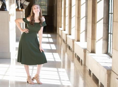 senior girl poses in Capitol hallway
